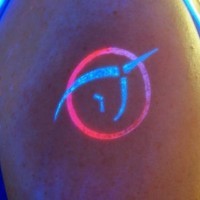 Unicorn symbol glowing tattoo