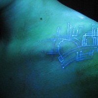 Digital board glowing ink tattoo