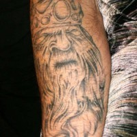 Viking king tattoo with crown on his head