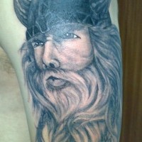 Handsome viking in horned helmet tattoo