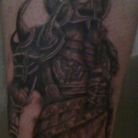 Strong viking warrior in dark armor tattoo