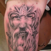 Angry viking warrior face on tattoo