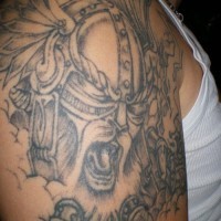 Viking tattoo of crying warrior in helmet