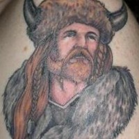 Tattoo of viking with long blond hair in furs