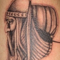 Black viking and ship tattoo