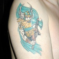 Colorful shoulder tattoo of viking in winged helmet