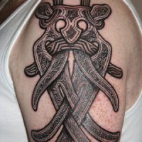 Viking mask shoulder tattoo in black ink