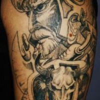 Big shoulder tattoo of viking and animal skull