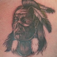Thoughtful indian warrior tattoo with feathers