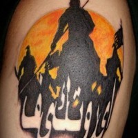 Eastern warrior tattoo with inіcription on sunset