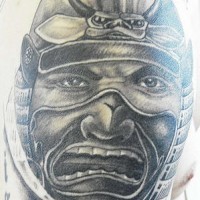 Krieger und kleiner Dämonenkopf Tattoo