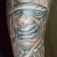 Warrior showing teeth tattoo with flowers