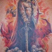 Power tattoo of warrior standing on skulls