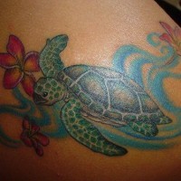 Tattoo with green turtle and flowers