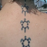 Water animal tattoo with small turtles on back neck