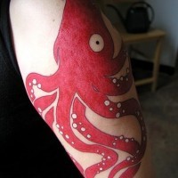 Big red octopus tattoo on hand