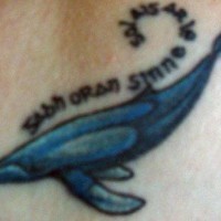 Water animal tattoo with whale and inscription