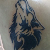 Howling tribal wolf tattoo