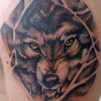 Angry wolf with yellow eyes tattoo