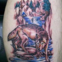 Colored tattoo with wolf near a rivulet