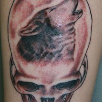 Tattoo with human skull and wolf