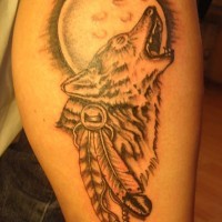 Wolf tattoo with a moon and feathers