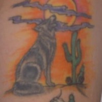 Tattoo with wolf in a desert