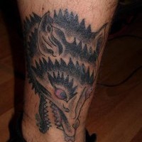 Funny wolf tattoo on the leg