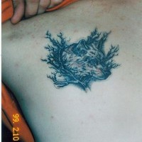 Wolf tattoo with shrubs