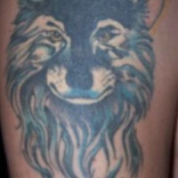 Beautiful blue wolf tattoo with the moon