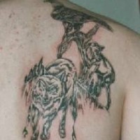 Tattoo with wolves and eagle on the scapula
