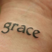 Grace little writing on wrist