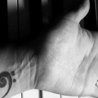 Musical note inner wrist tattoo