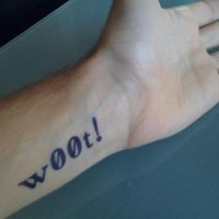 Woot writing on wrist tattoo