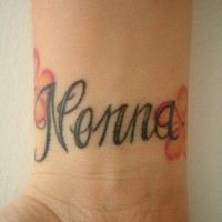 Calligraphic tattoo with word Nonna on inner side of hand