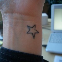 Classic star tattoo on wrist