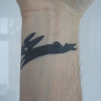 Running black fox tattoo on inner side of hand