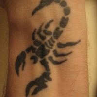 Black scorpion inner wrist tattoo