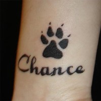 Dog paw wrist tattoo