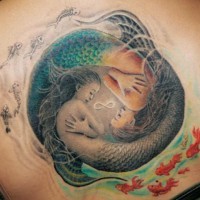 Ying yang style two mermaids tattoo