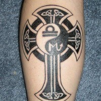 Black yin yang tattoo with a cross