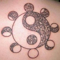 Black yin yang tattoo with moons
