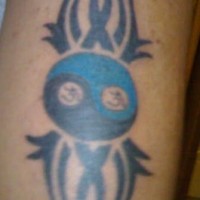 Small yin yang tribal tattoo