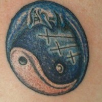 Blue yin yang tattoo