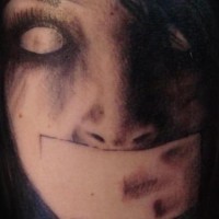 Zombie taped mouth tattoo