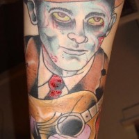 Tatuaje el zombi con la guitarra