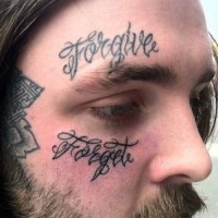 Tattoo forgive on face for men