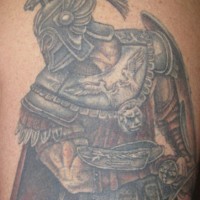 Tattoo of armored warrior with two birds on back