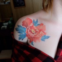 Tender pale red peony flower tattoo on shoulder of young lady