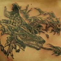 Terrible dragon under skin rip tattoo on chest